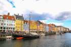 Copenhagen, Denmark. Nyhavn, painted houses by canal. Coastal Print